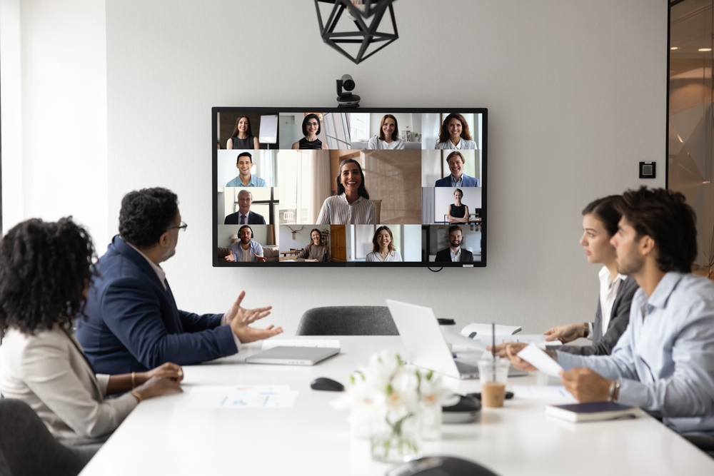 Boardroom with wall display, ceiling microphones and touch-panel control