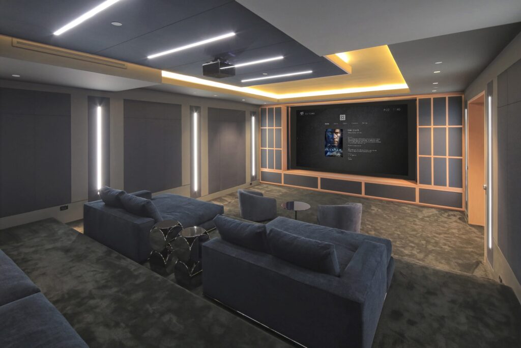 Dedicated home theatre with projection screen and tiered seating